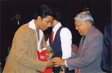 Distributing prizes to brillant students